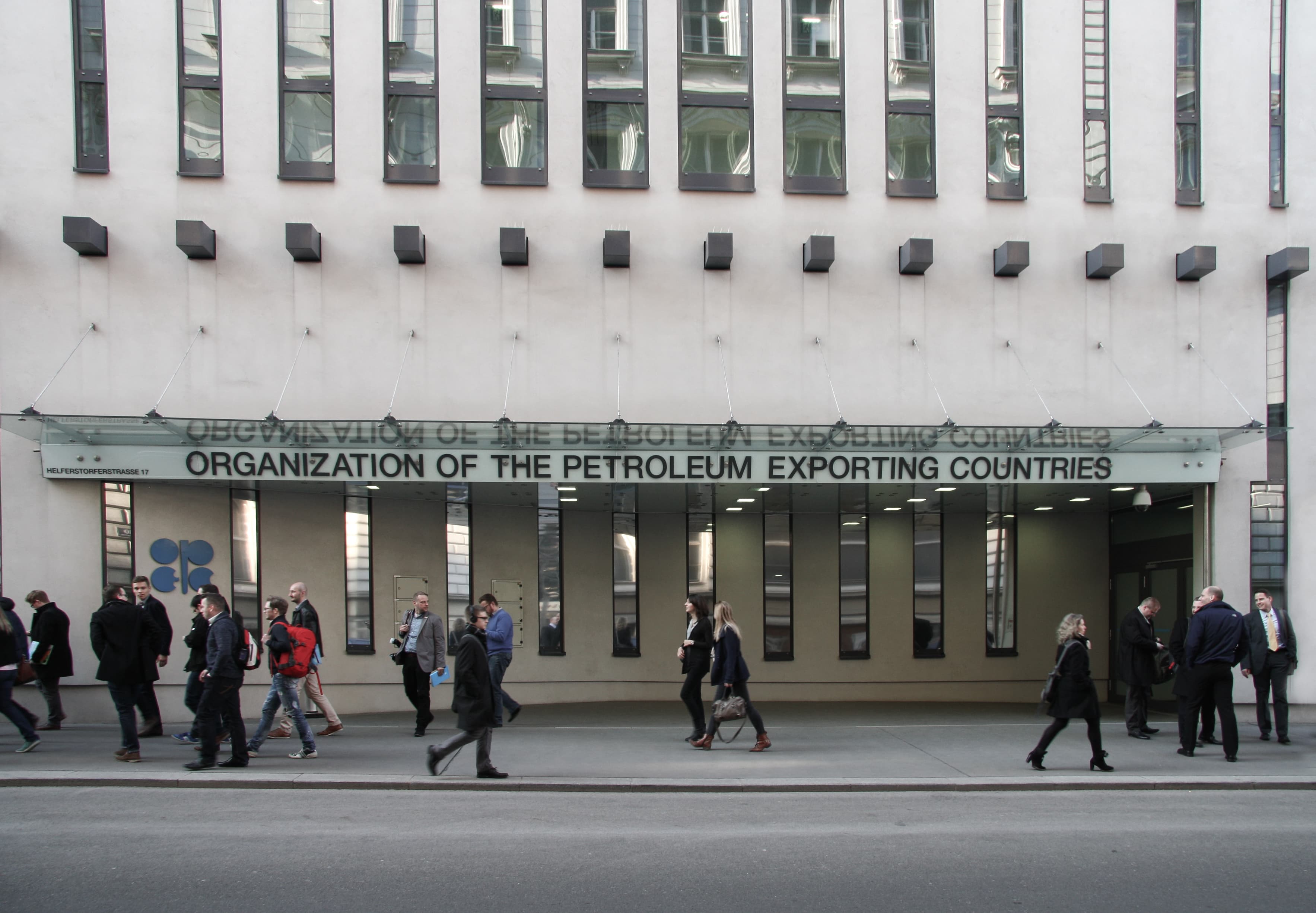 Pedestrians outside the entrance of OPEC headquarters in Vienna in a 2015 contextual photograph