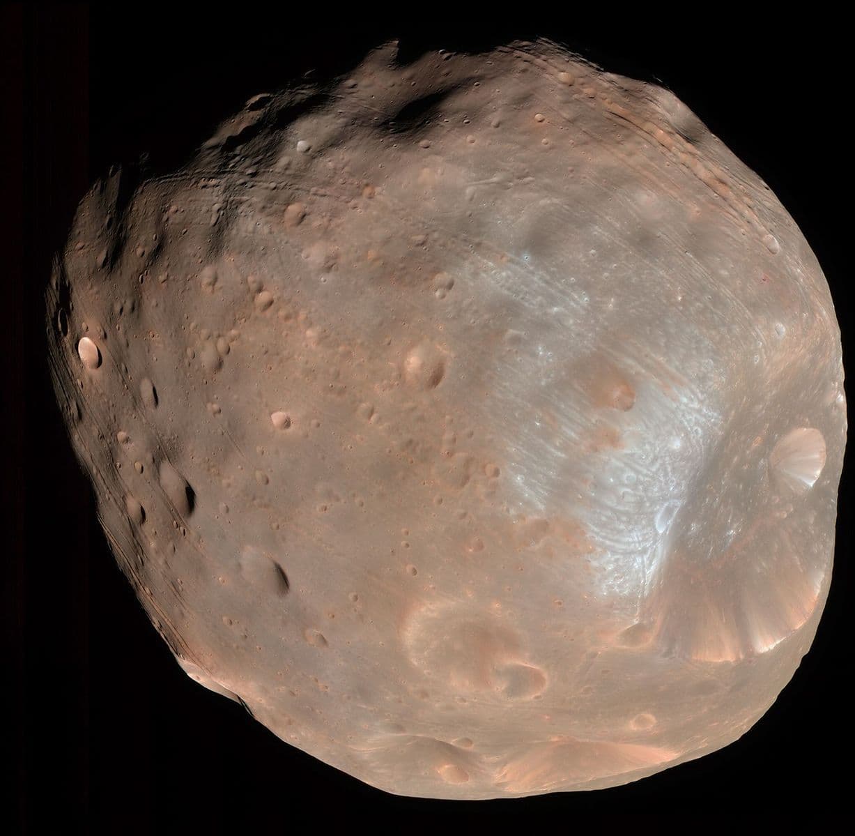 Enhanced-color image of Phobos taken by NASA's Mars Reconnaissance Orbiter on March 23, 2008; historical destination context, not an MMX photograph.