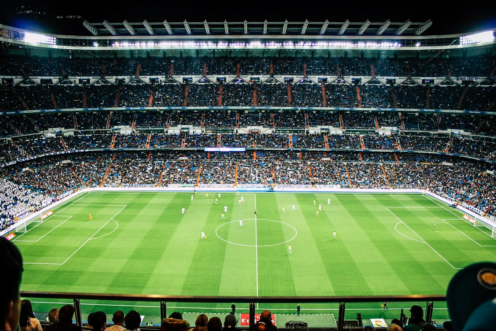 A packed soccer stadium during a night match