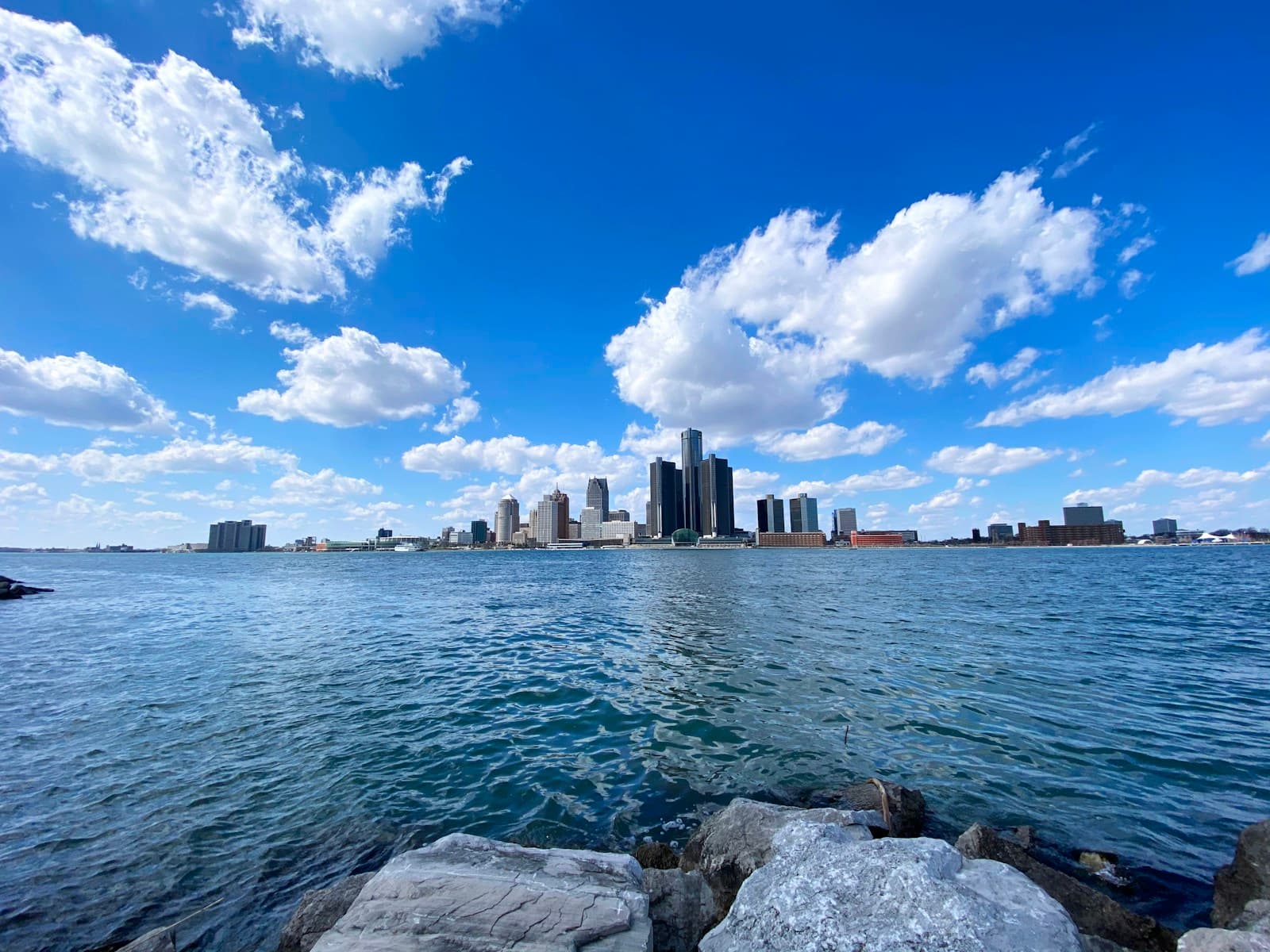 Detroit's skyline seen from the Windsor riverfront, offering regional context for the Gordie Howe International Bridge opening delay story.