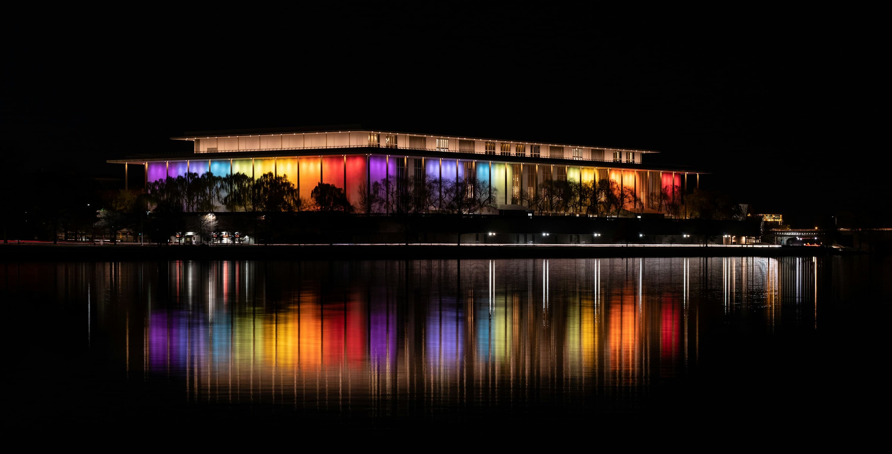 The John F. Kennedy Center for the Performing Arts lit at night and reflected in the Potomac in Washington, D.C.