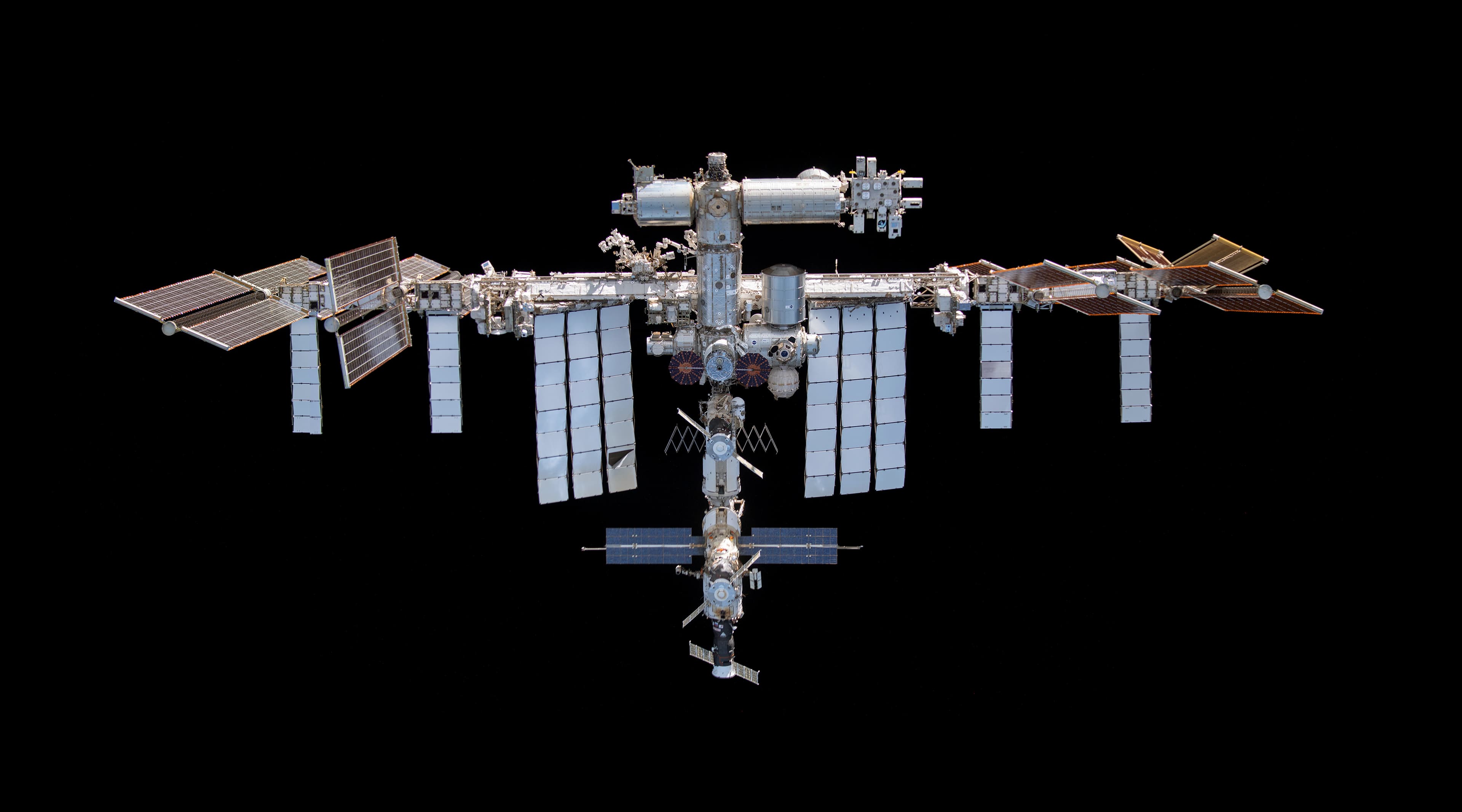 NASA mosaic of the International Space Station photographed during a Crew Dragon fly-around on November 8, 2021; historical context.